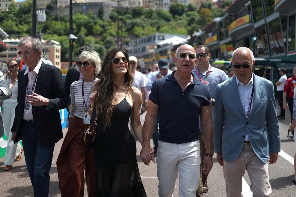 Derek Chang, Chief Executive Officer of Liberty Media Corporation, Jeff Bezos and Lauren Sanchez on the grid