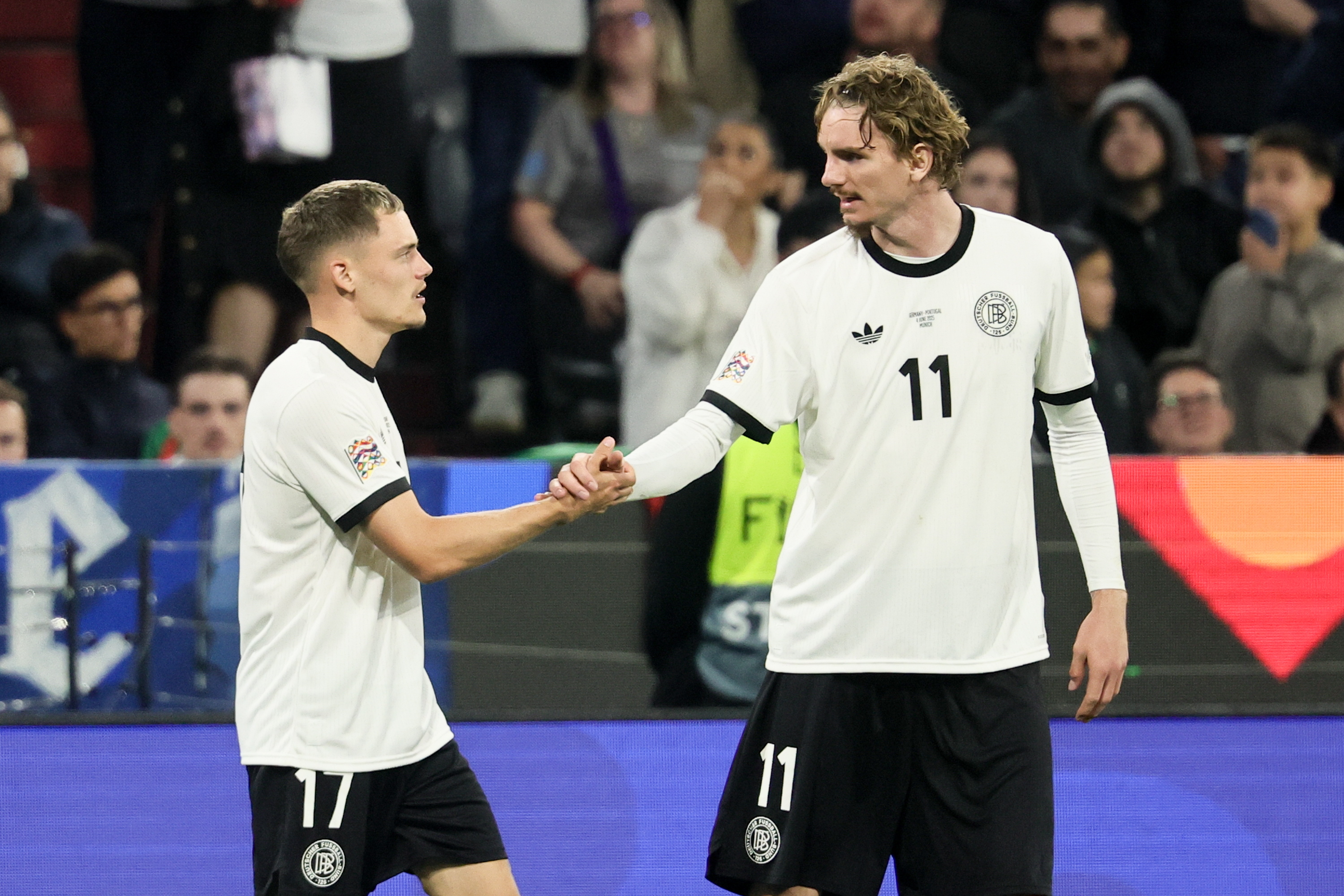 Munich (Germany), 04/06/2025.- Florian Wirtz (L) of Germany celebrates with teammate Nick Woltemade after scoring the 1-0 goal during the UEFA Nations League semi-final soccer match between Germany and Portugal, in Munich, Germany, 04 June 2025. (Alemania) EFE/EPA/RONALD WITTEK
