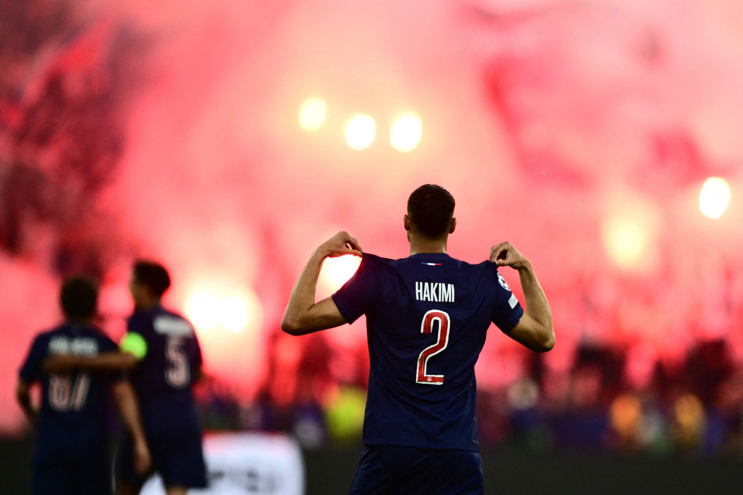 Paris Saint-Germain's Moroccan defender #02 Achraf Hakimi celebrates after scoring during the UEFA Champions League final football match between Paris Saint-Germain (PSG) and Inter Milan in Munich, southern Germany on May 31, 2025. (Photo by Marco BERTORELLO / AFP)