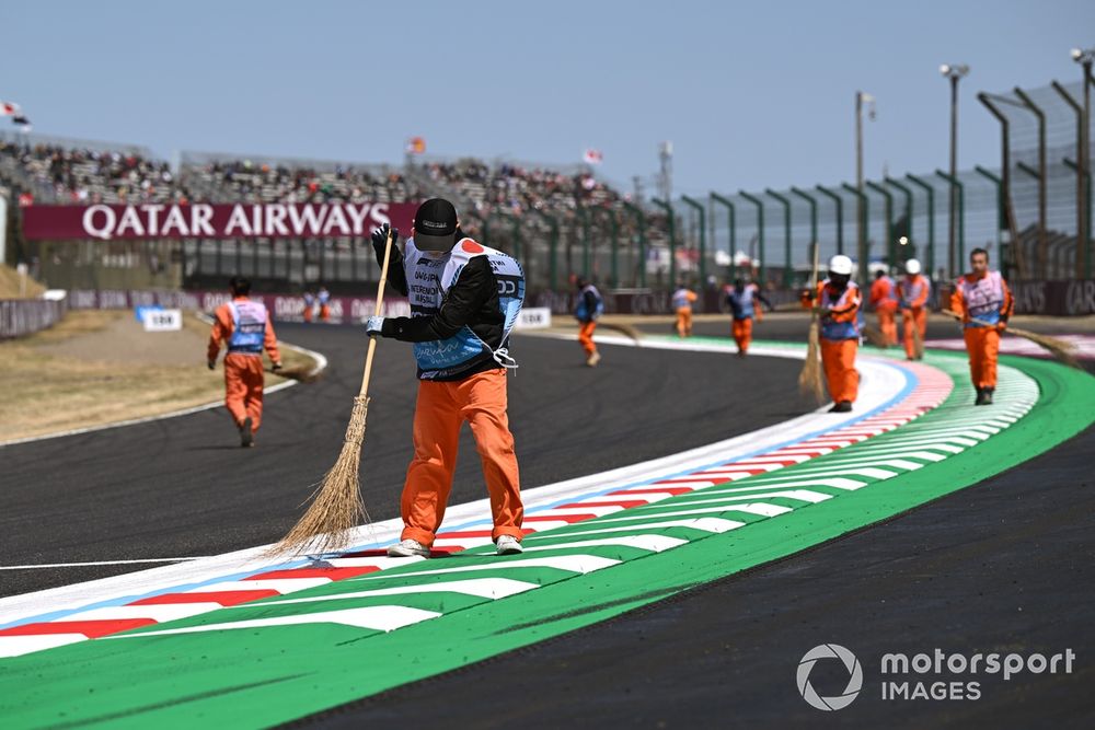 Marshals sweep the track 