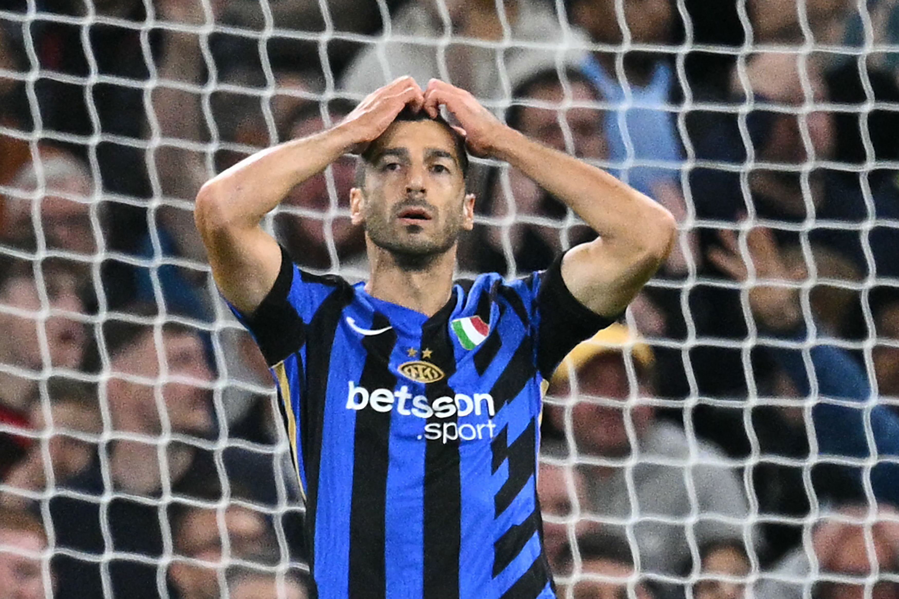 Inter Milan's Armenian midfielder #22 Henrikh Mkhitaryan reacts after missing a chance during the UEFA Champions League, league phase football match between Manchester City and Inter Milan at the Etihad stadium, in Manchester, north-west England, on September 18, 2024 (Photo by Oli SCARFF / AFP)