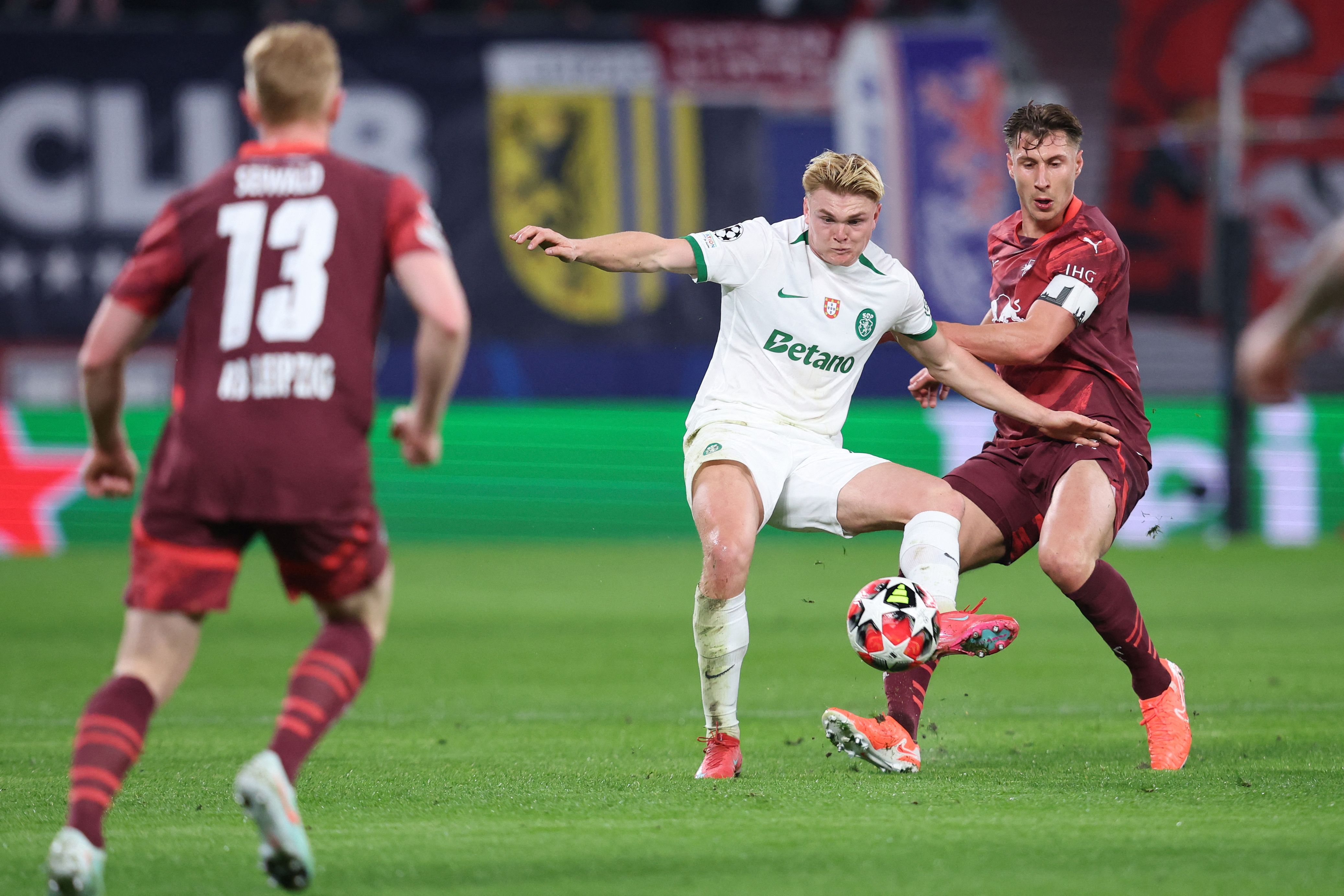 Leipzig's Hungarian defender #04 Willi Orban (R) and Sporting's Danish forward #19 Conrad Harder vie for the ball during the UEFA Champions League football match between RB Leipzig and Sporting CP in Leipzig, eastern Germany on January 22, 2025. (Photo by Ronny HARTMANN / AFP)