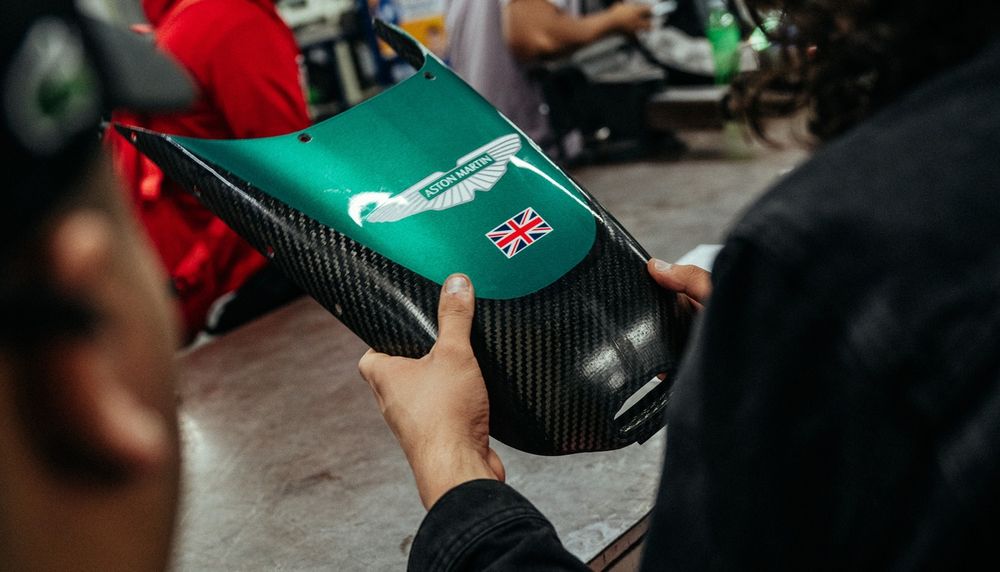 Aston Martin F1 team members and Valvoline meet with students at the Escuela Mexicana de Electricidad