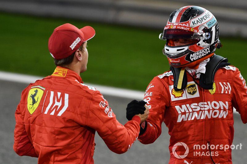 Sebastian Vettel, Ferrari, and Charles Leclerc, Ferrari, congratulate each other on locking out the front row