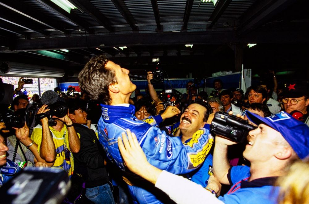 Michael Schumacher celebrates championship victory with his team