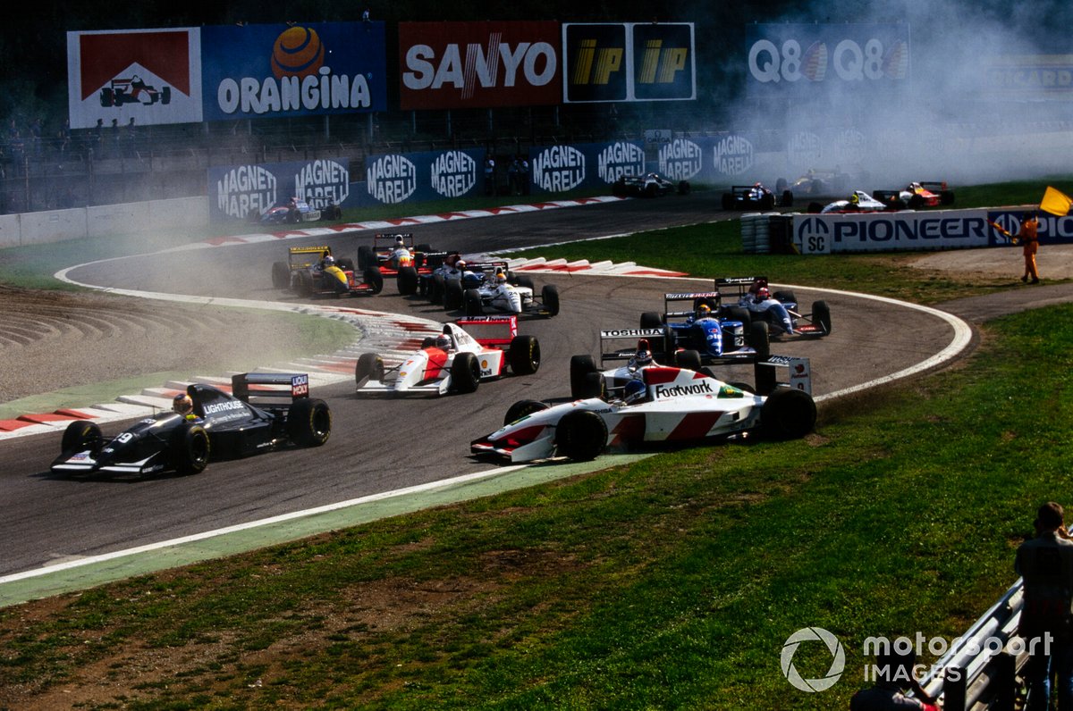 Derek Warwick, Footwork FA14 Mugen-Honda, is hit and spun by teammate Aguri Suzuki, Footwork FA14 Mugen-Honda, at the start after being tapped by Karl Wendlinger, Sauber C12